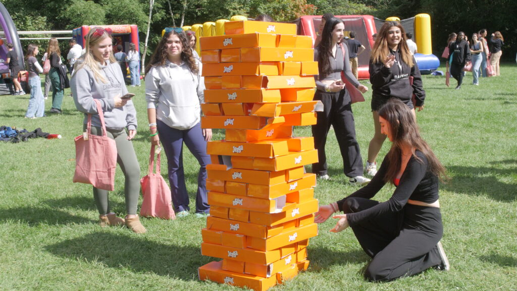 students playing a giant jenga game.