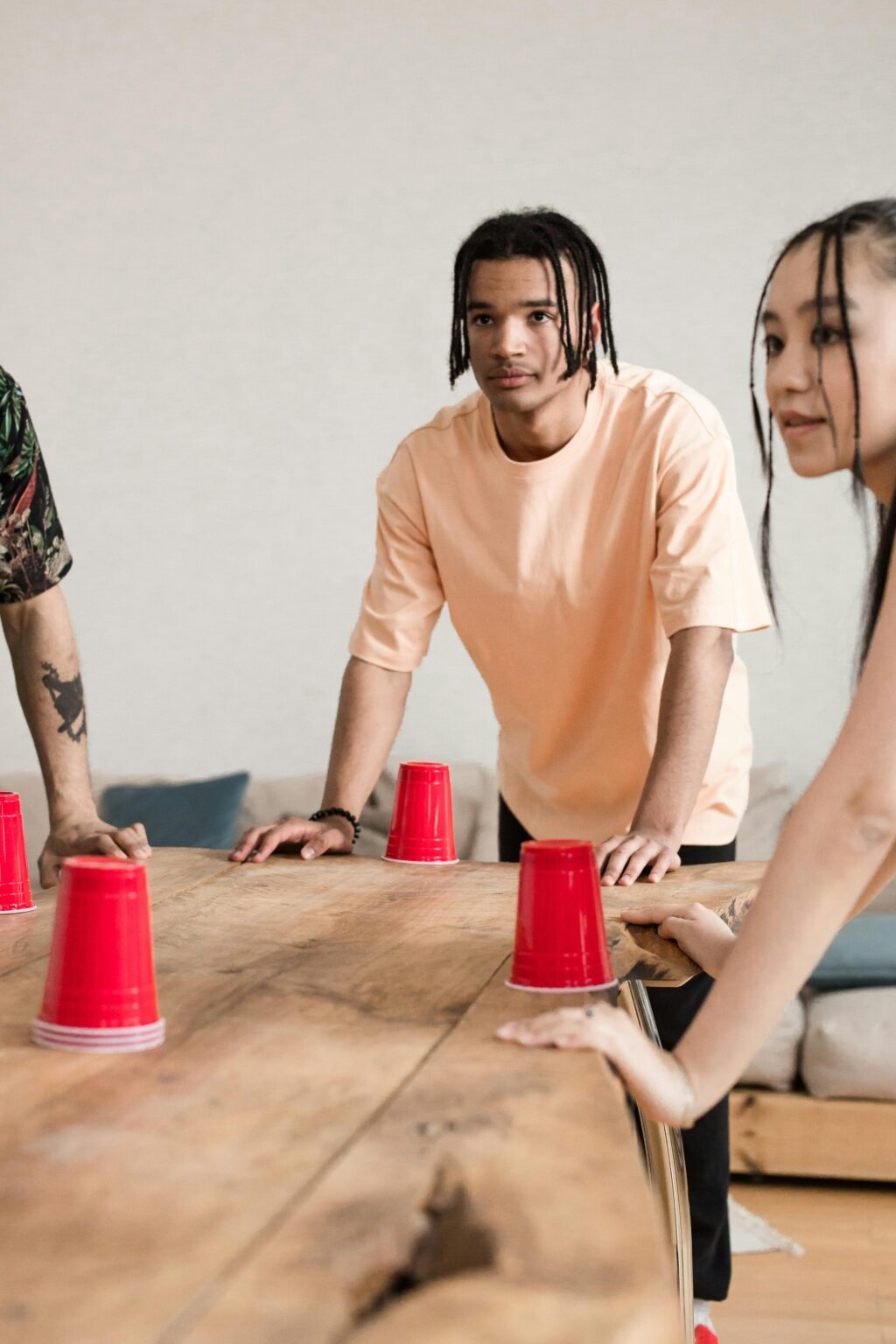 students playing a flip cup game.
