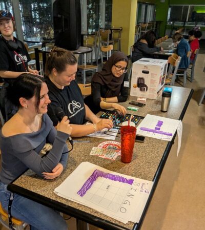 Bingo Callers working from a table.
