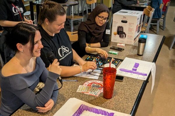 Bingo Callers working from a table.