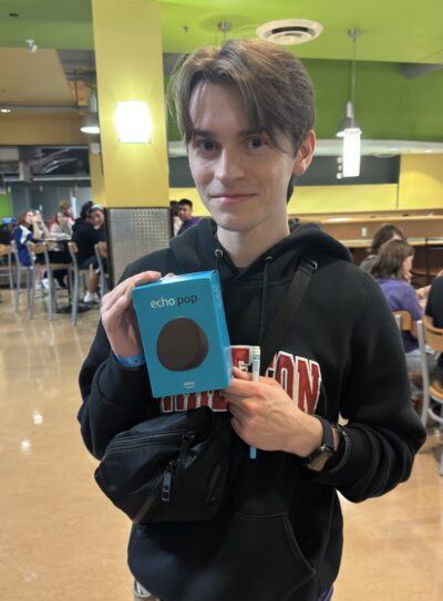 Student displaying their Bingo Prize: Echo Pop.
