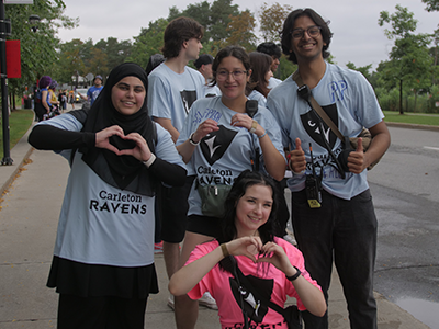 Group of fall orientation student volunteers wearing their ravens shirts.