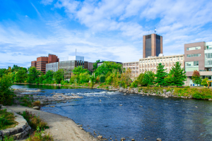 The campus skyline with a large river in the foreground