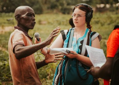 A Carleton Journalism student interviews a farmer about climate resilient practices in Ghana.