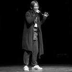 Xiaoran singing in black and white