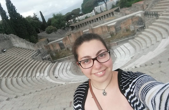 Elif in front of what looks like the Colleseum