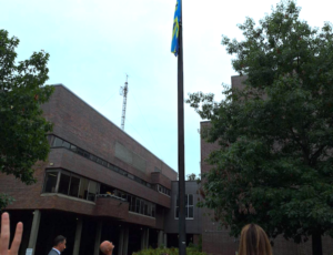 People watch the flag rise