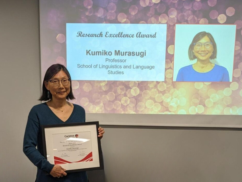 Kumiko Murasugi with her FASS Research Excellence Award