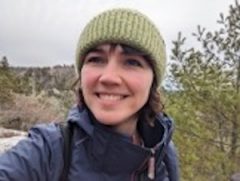 Laura in nature wearing a toque