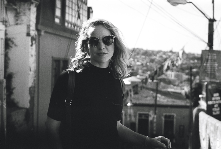 Chloe in black and white against the skyline of Valparaiso