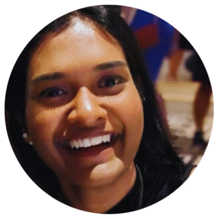 Rumya smiles at the camera