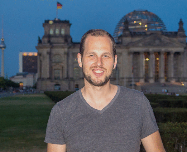 Adam standing in front of the Bundestag