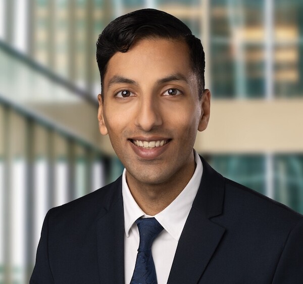 Jabir in a suit and tie.