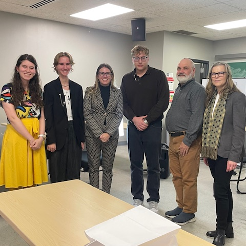 Students pose with Professor Cristina Trevisan