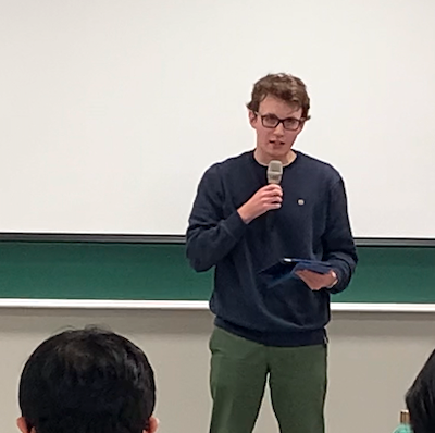 Student reciting poem at Hangeul Day event on October 10