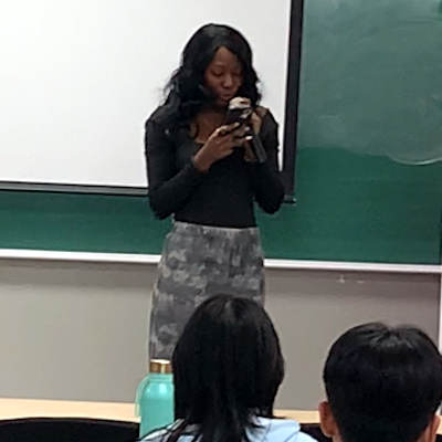 Student reciting poem at Hangeul Day event on October 10