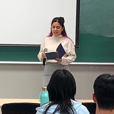 Student reciting poem at Hangeul Day event on October 10