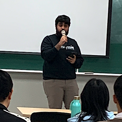 Student reciting poem at Hangeul Day event on October 10
