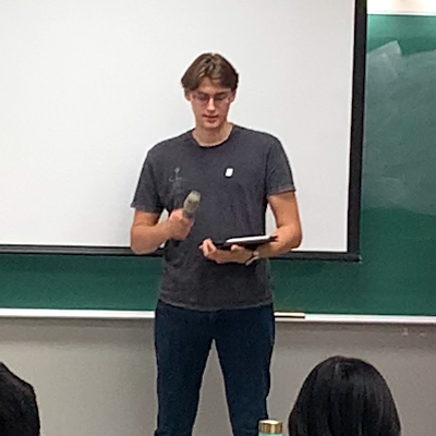 Student reciting poem at Hangeul Day event on October 10