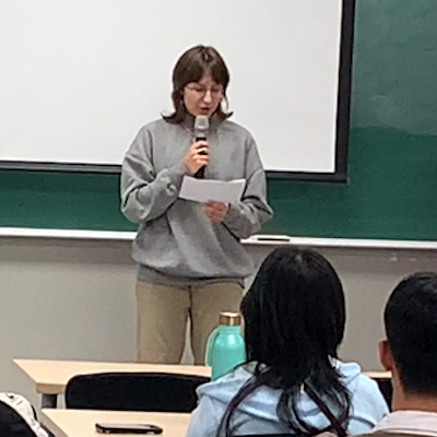 Student reciting poem at Hangeul Day event on October 10