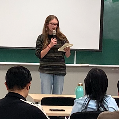 Student reciting poem at Hangeul Day event on October 10