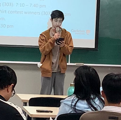 Student reciting poem at Hangeul Day event on October 10