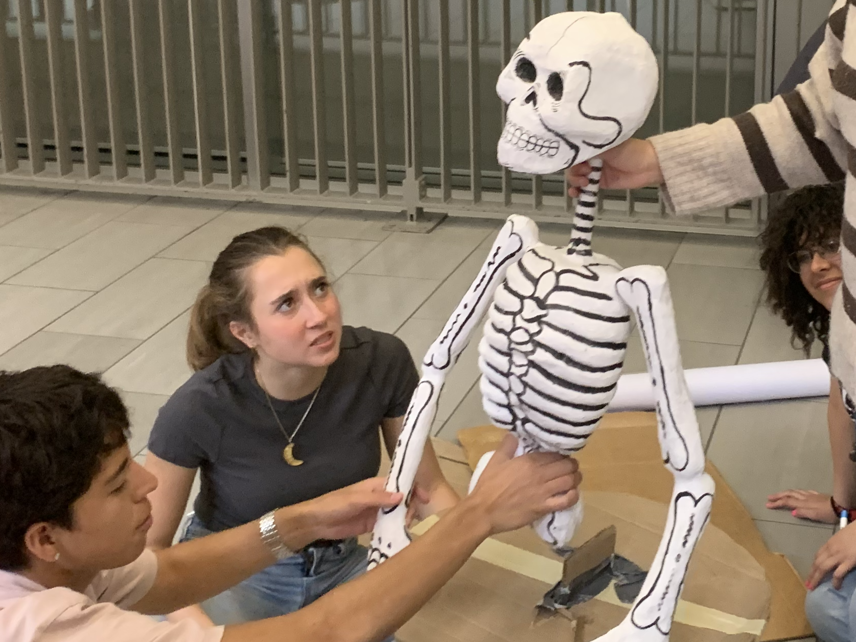Image of students with skeleton