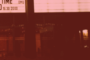 Front of a movie theatre with marquee