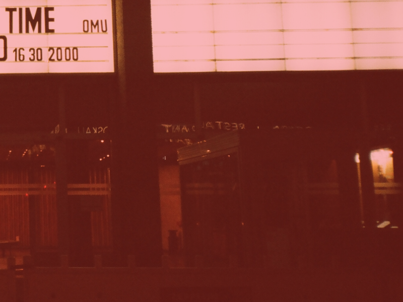 Front of a movie theatre with marquee