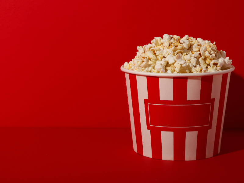 Bag of popcorn with red background