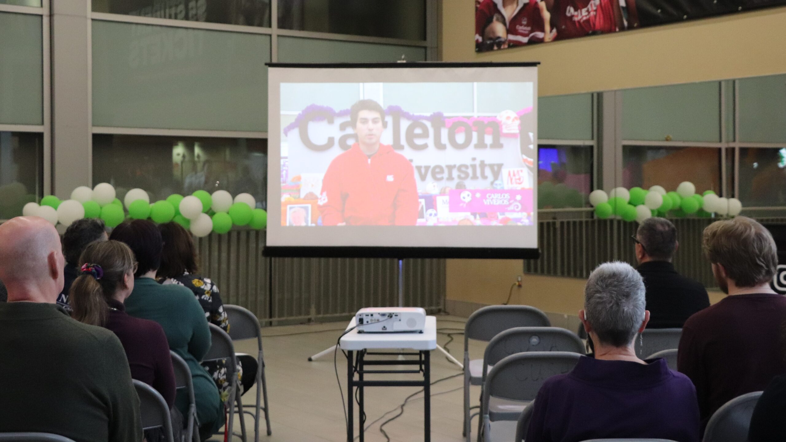 Image of student video projected on screen at Day of the Dead event