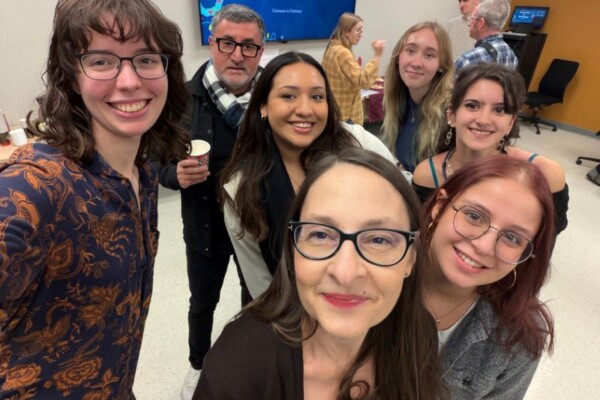 German language instructor Cristina Finger with students at Adventskaffee on November 28, 2025