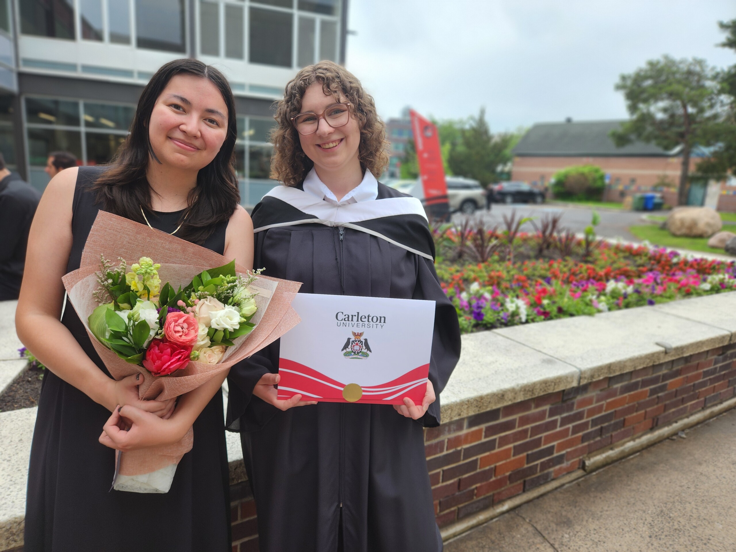 Image of two graduates, Abigail and Nadine