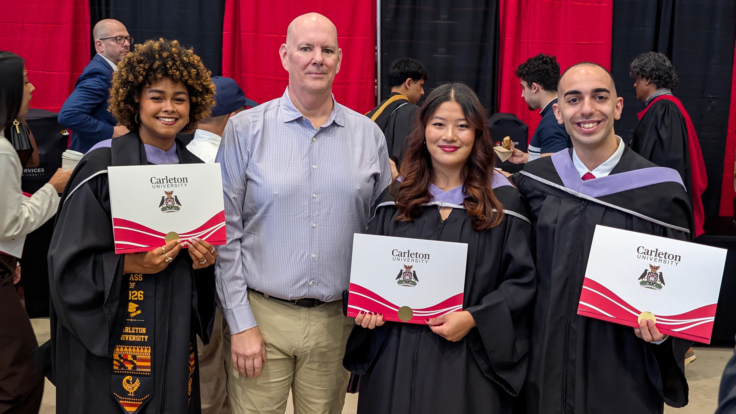 Image of CTESL graduates Kiara, Caitlyn, and Jacob, with professor Don Myles at convocation