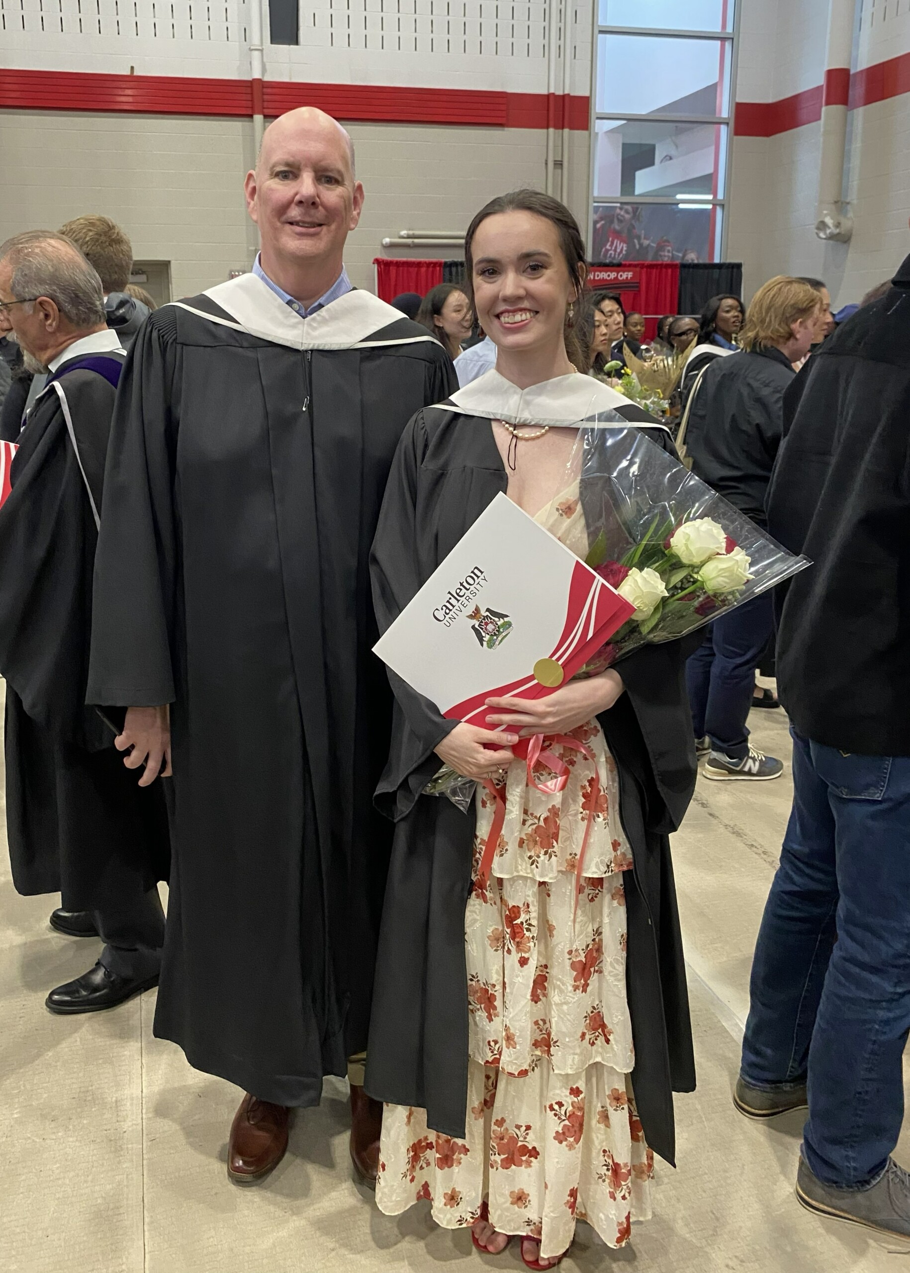 Image of a graduate, Courtney, with professor Don Myles