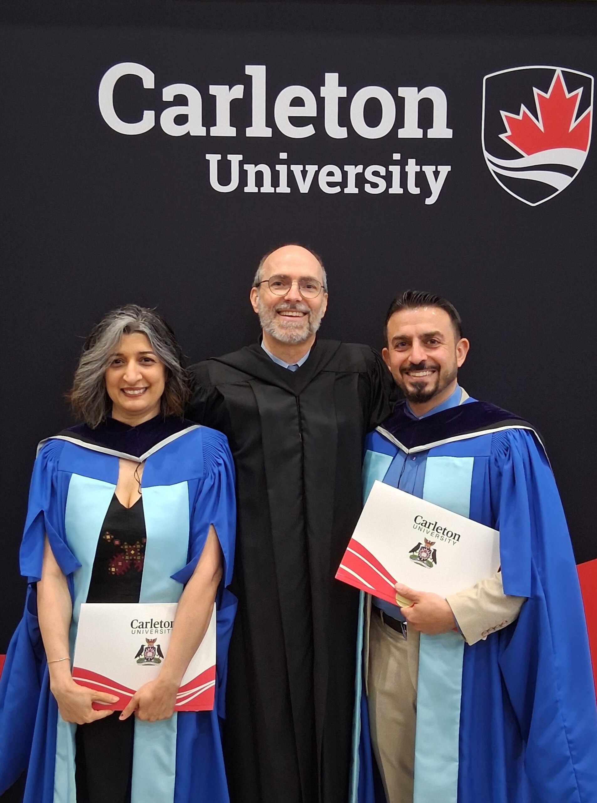 Image of graduates Hamideh and Hakam with their PhD supervisor Erik Anonby