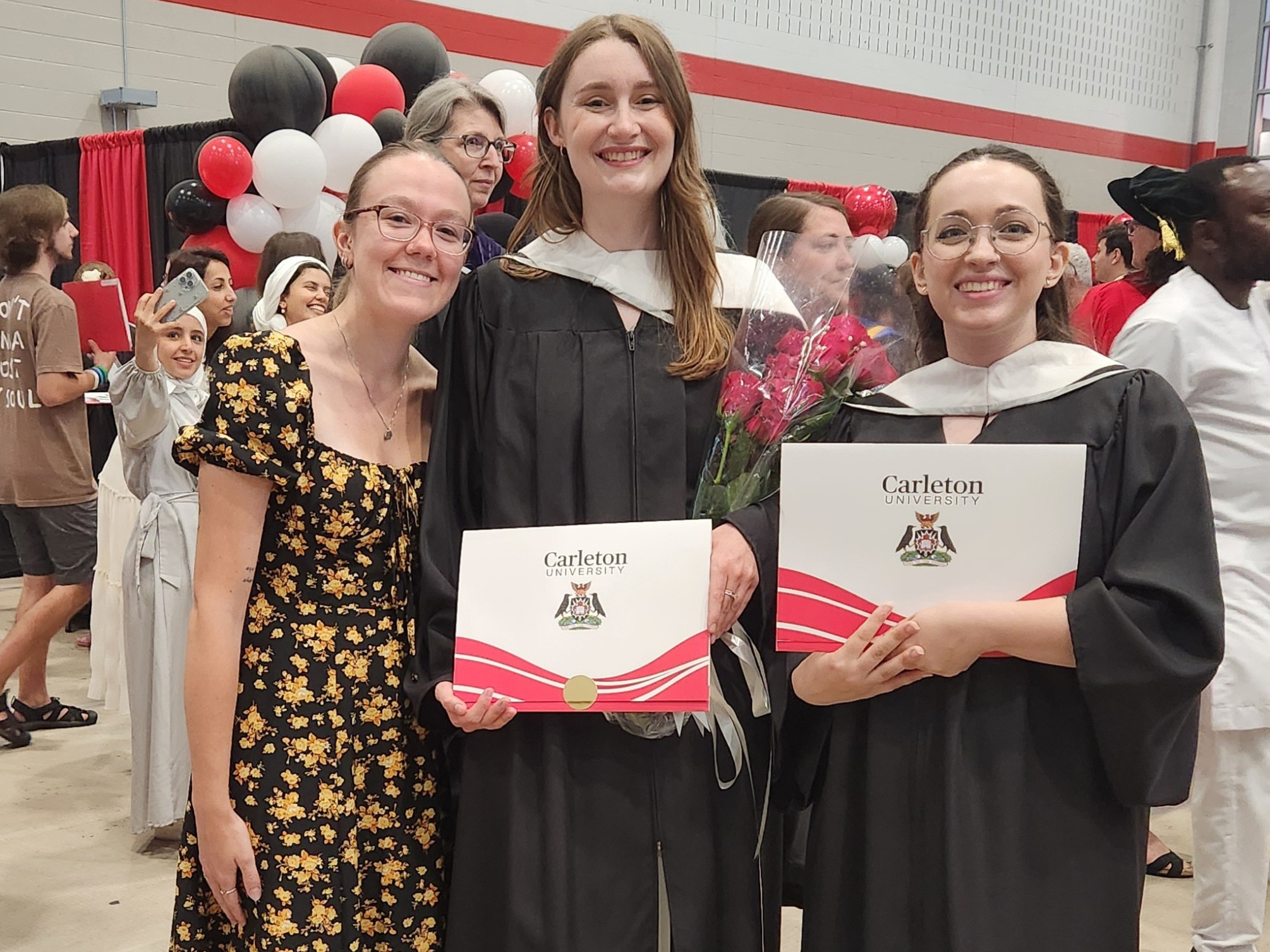 Graduates Hanna and Kai with friend (and current SLaLS student) Morgan