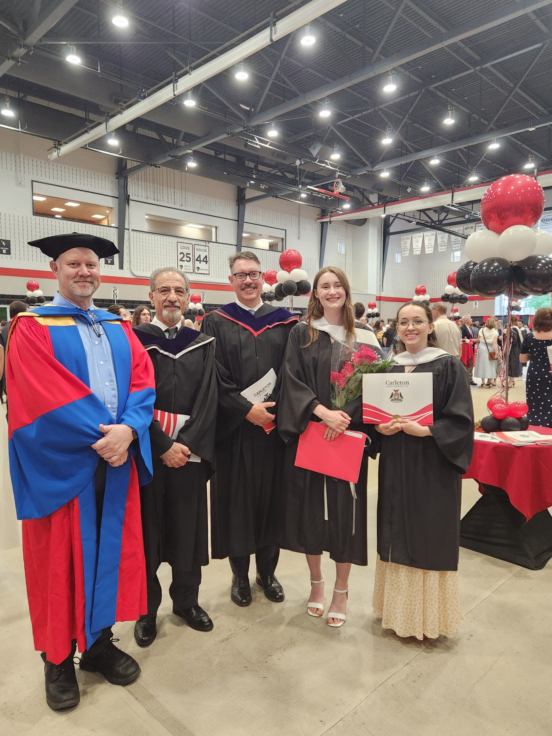 Graduates Hanna and Kai with professors Geoff Pinchbeck, Jaffer Sheyholislami, and Michael Rodgers at convocation