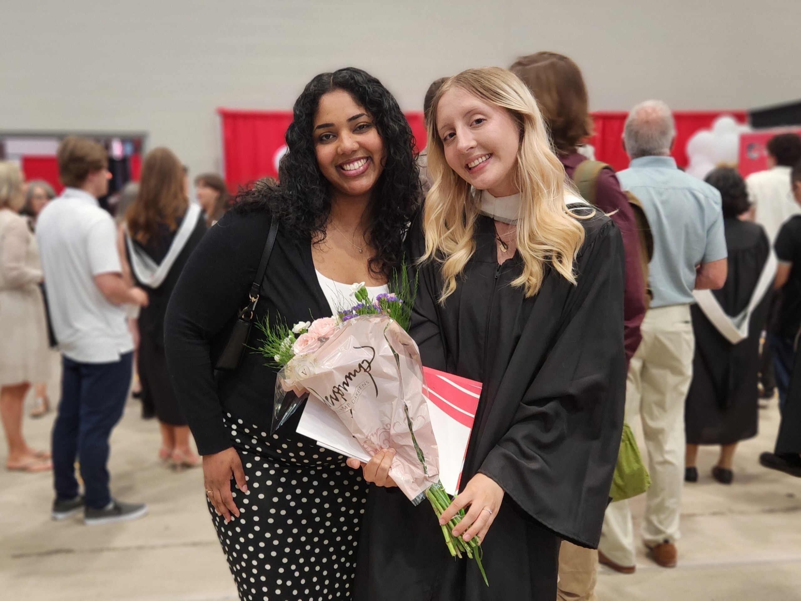 Image of graduate Holly with friend (and SLaLS alum) Nyla