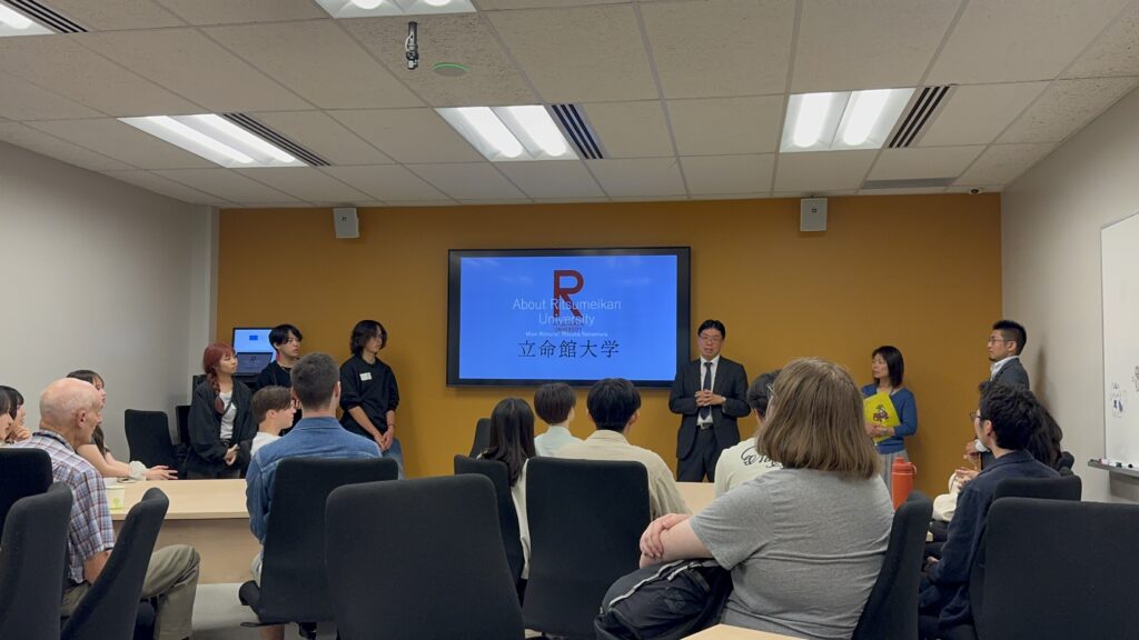 Visiting faculty members introduce Ritsumeikan University with a PPT.