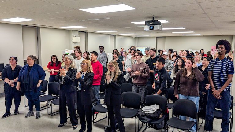 Group standing up to sing along to opera