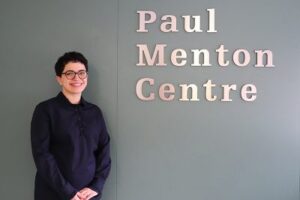 Frohan standing in front of Paul Menton Centre