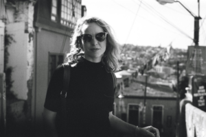 Chloe in black and white against the skyline of Valparaiso