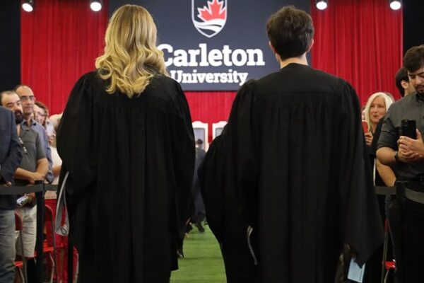 Two people robed at Carleton University convocation