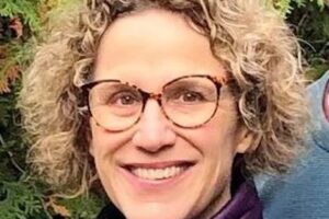 Peggy smiles at the camera