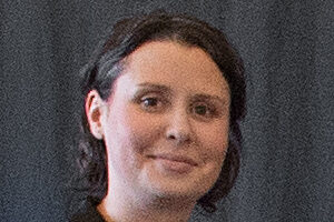 Julie looks at camera