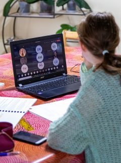 Young woman looks at computer screen