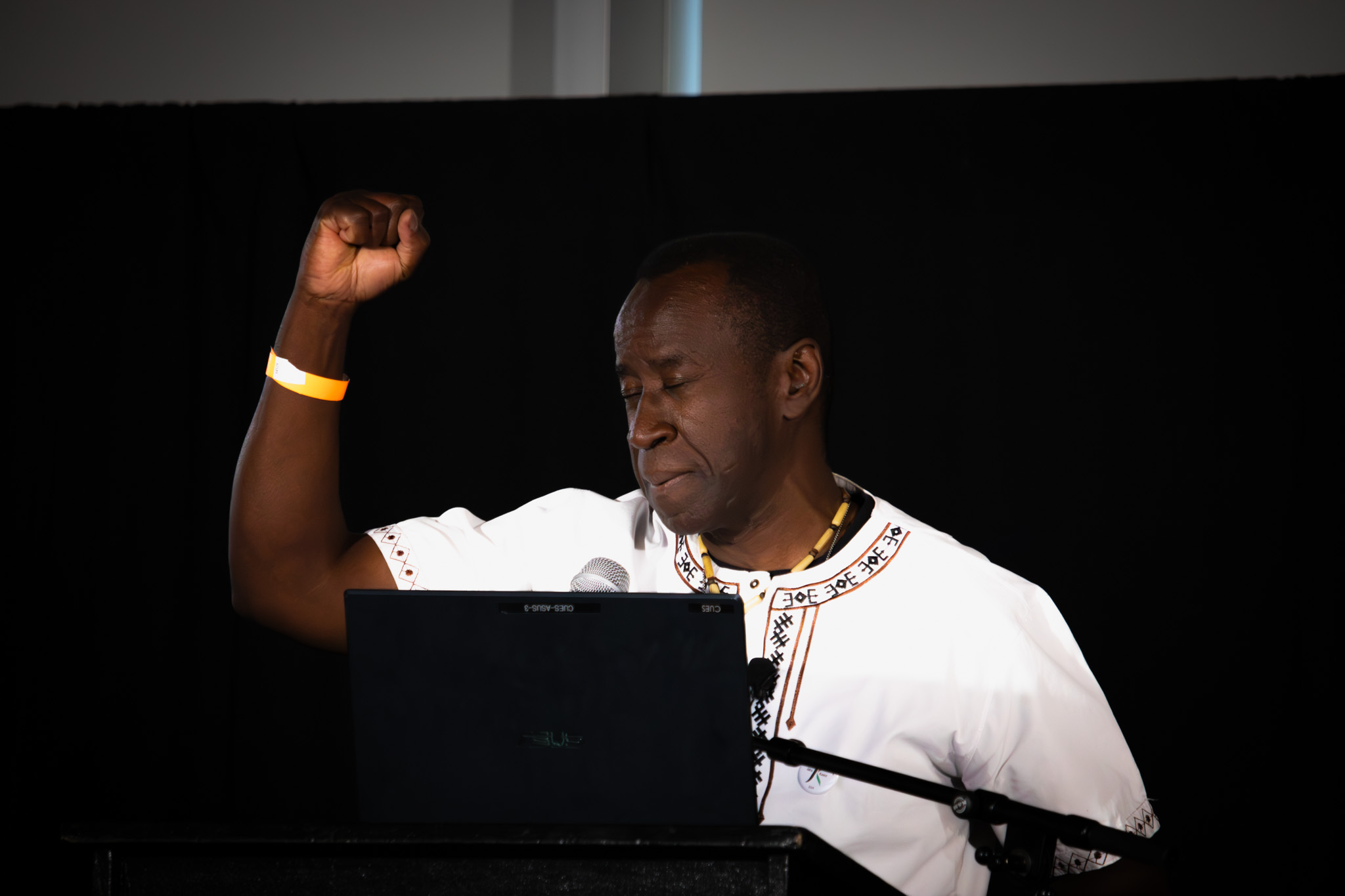 Picture of an event speaker at a podium.