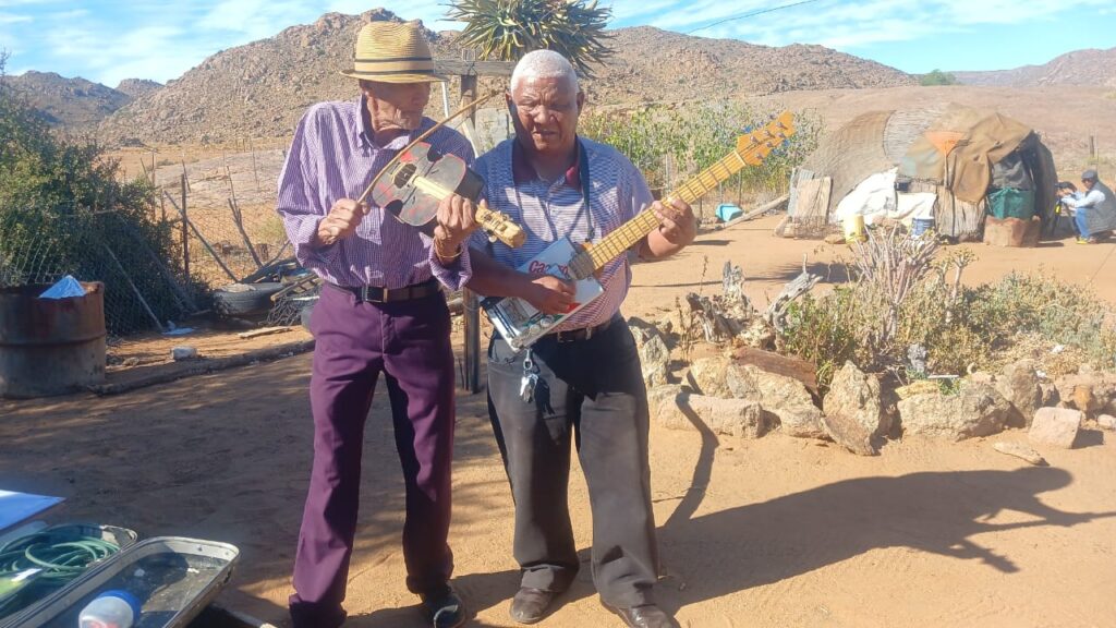 Image of musician Sylvester Fortuin (right) performing with a colleague and contributes recordings to the project archive.