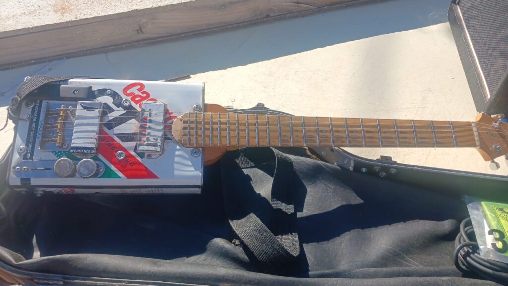 Image of Sylvester Fortuin’s homemade instrument, resembling a cigar box guitar.